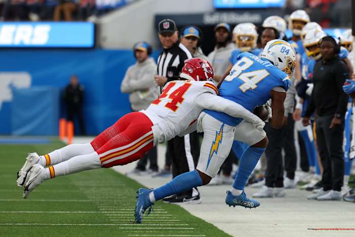Los Angeles Chargers tight end Stone Smartt (84) is tackled by Kansas City Chiefs linebacker Cam Jones (44) during the second quarter at SoFi Stadium.